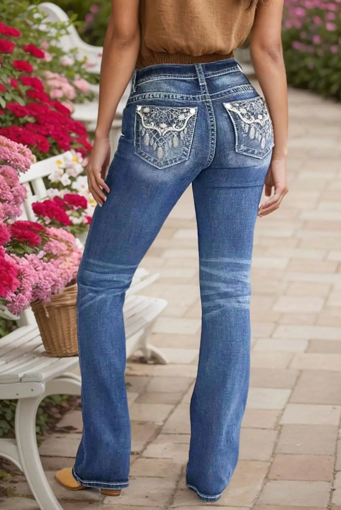 Women's Embroidered Wash Denim Jeans with heavy-duty stitching and intricate embroidery on back pockets, in blue wash.