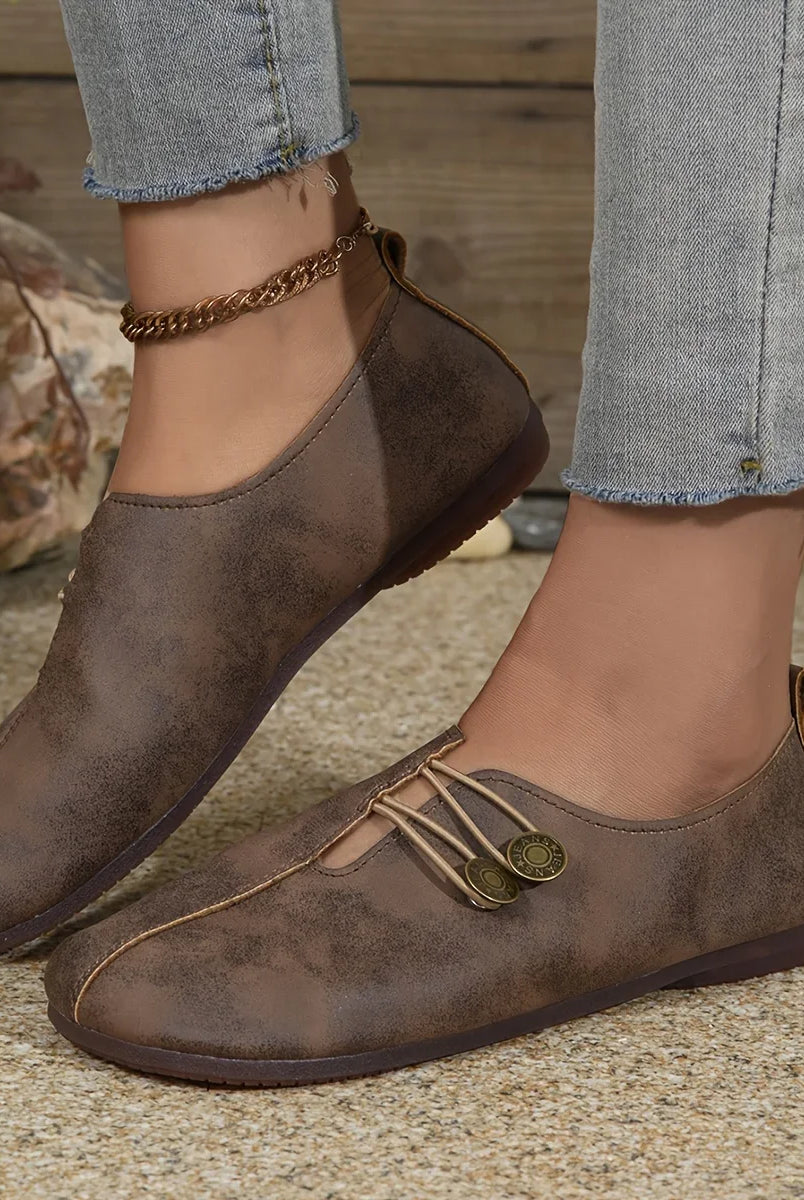 Comfortable soft sole round toe flats shoes for women in brown with buckle decoration, casual, breathable, slip-on design.
