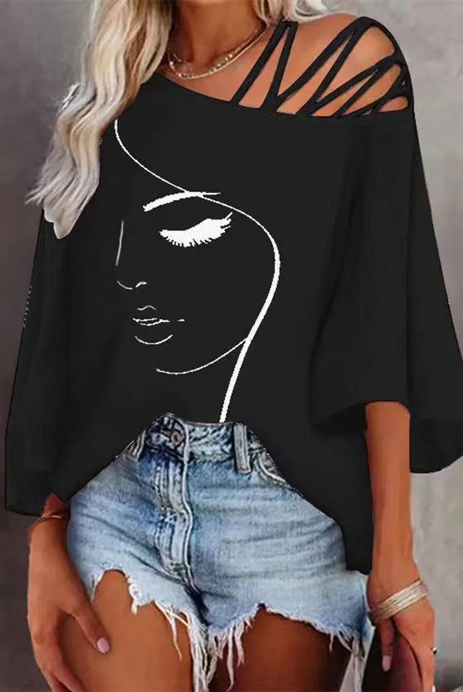 New wholesale autumn fashion patchwork loose casual women's printed T-shirt with a face outline design in white on black fabric.