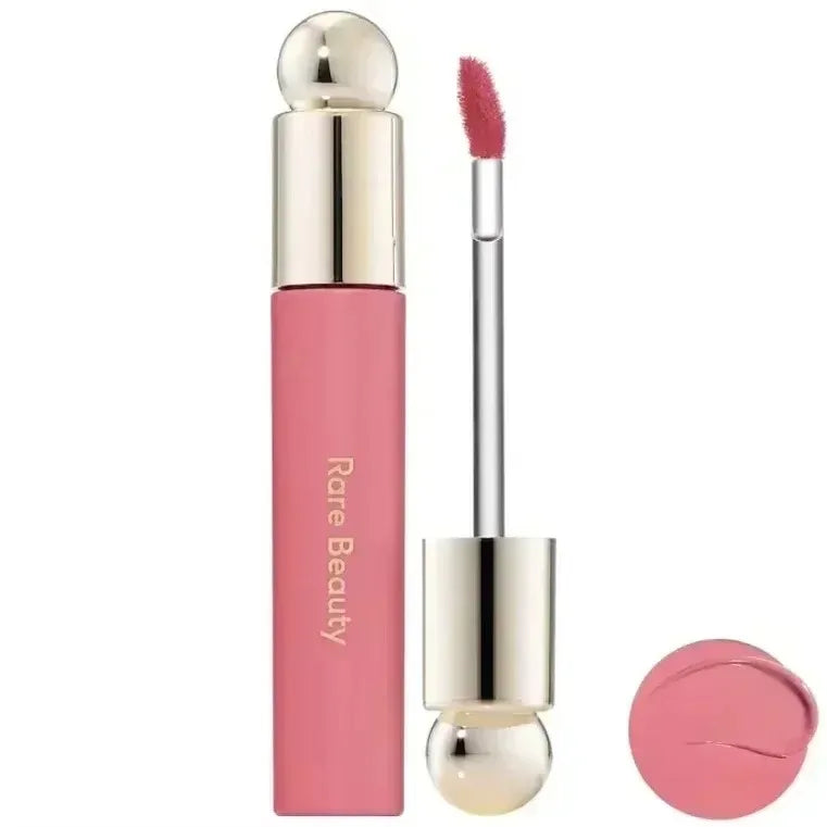 Rare Beauty 7-Colors Soft Pinch Tinted Lip Oil Stain Lip Gloss in pink with a silver and gold applicator and a matching pink
