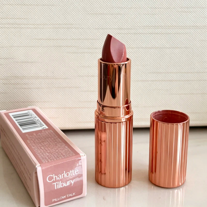 Charlotte Tilbury Walk of No Shame pink lipstick with matching Pillow Talk moisturizing plumping lip gloss in a rose gold
