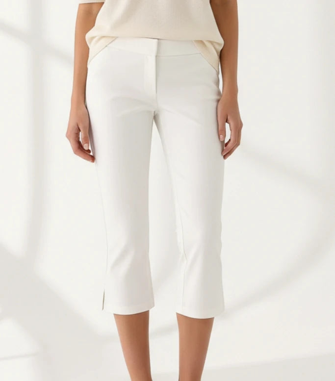 Women Summer Capri Pants casual low waist slim fit cropped trousers in solid white with dot print detail.