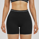 Women Running Sports Shorts Buttock Lift Gym Leggings Women Summer Shorts Cycling Slim Fit Workout Shorts High Waist Yoga Shorts in black with white trim.