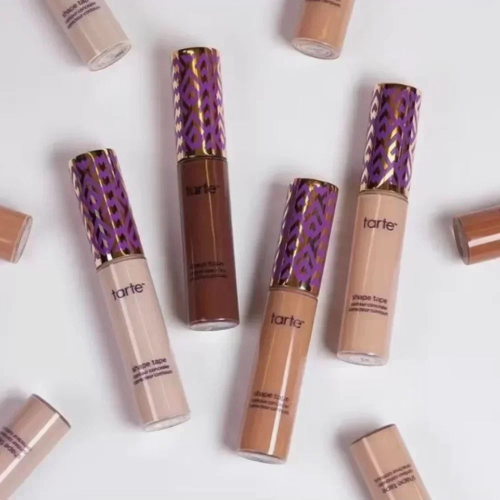 Liquid concealer waterproof oil-control makeup foundation by Tarte in beige and brown shades with purple and gold patterned