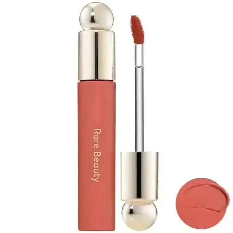 Rare Beauty 7-Colors Soft Pinch Tinted Lip Oil Stain Lip Gloss in natural peachy shade with silver and gold packaging and