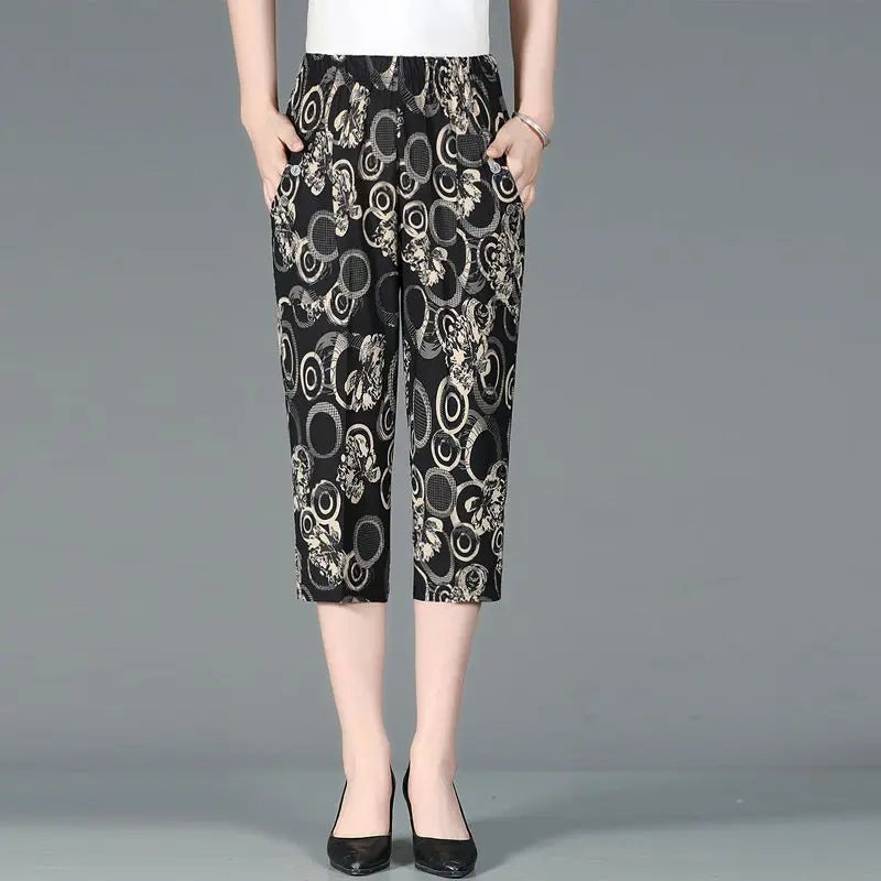 Summer New High Waist Capri Pants with elastic waist, patchwork floral print, loose straight fit, and pockets for women.