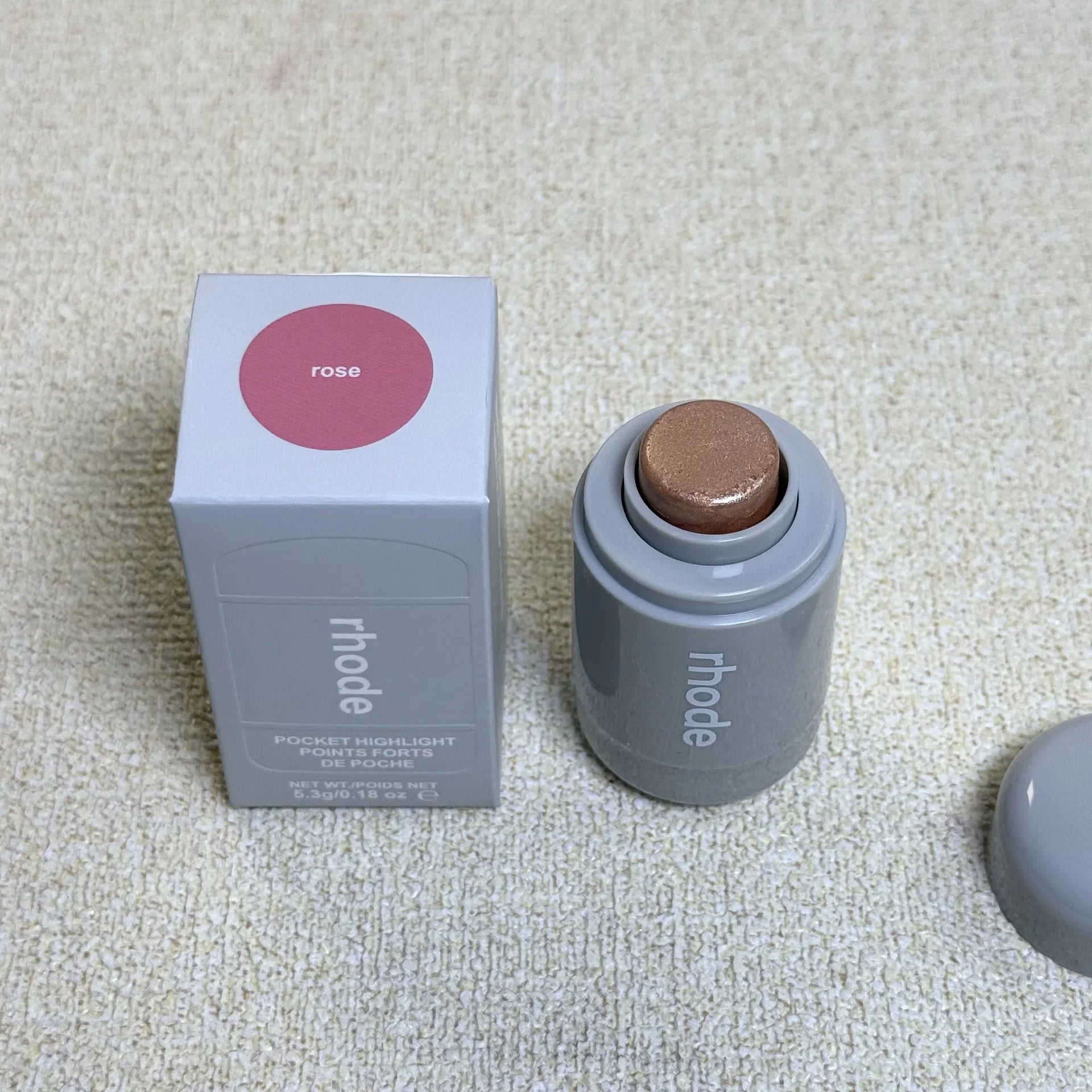 Rhode Highlight Stick in four brightening colors: bronze, sunlight, pearl, and rose, with a glossy, shiny finish for
