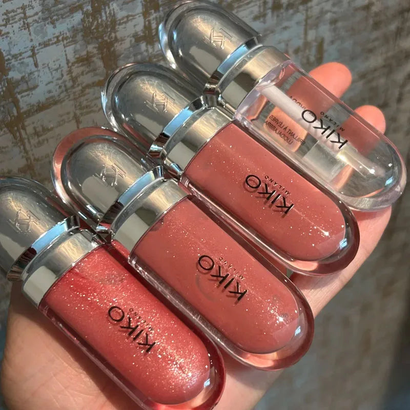 Three Kiko 3D Hydra Lip Gloss tubes in shades of pink with shimmering, moisturizing, long-lasting, waterproof formula.