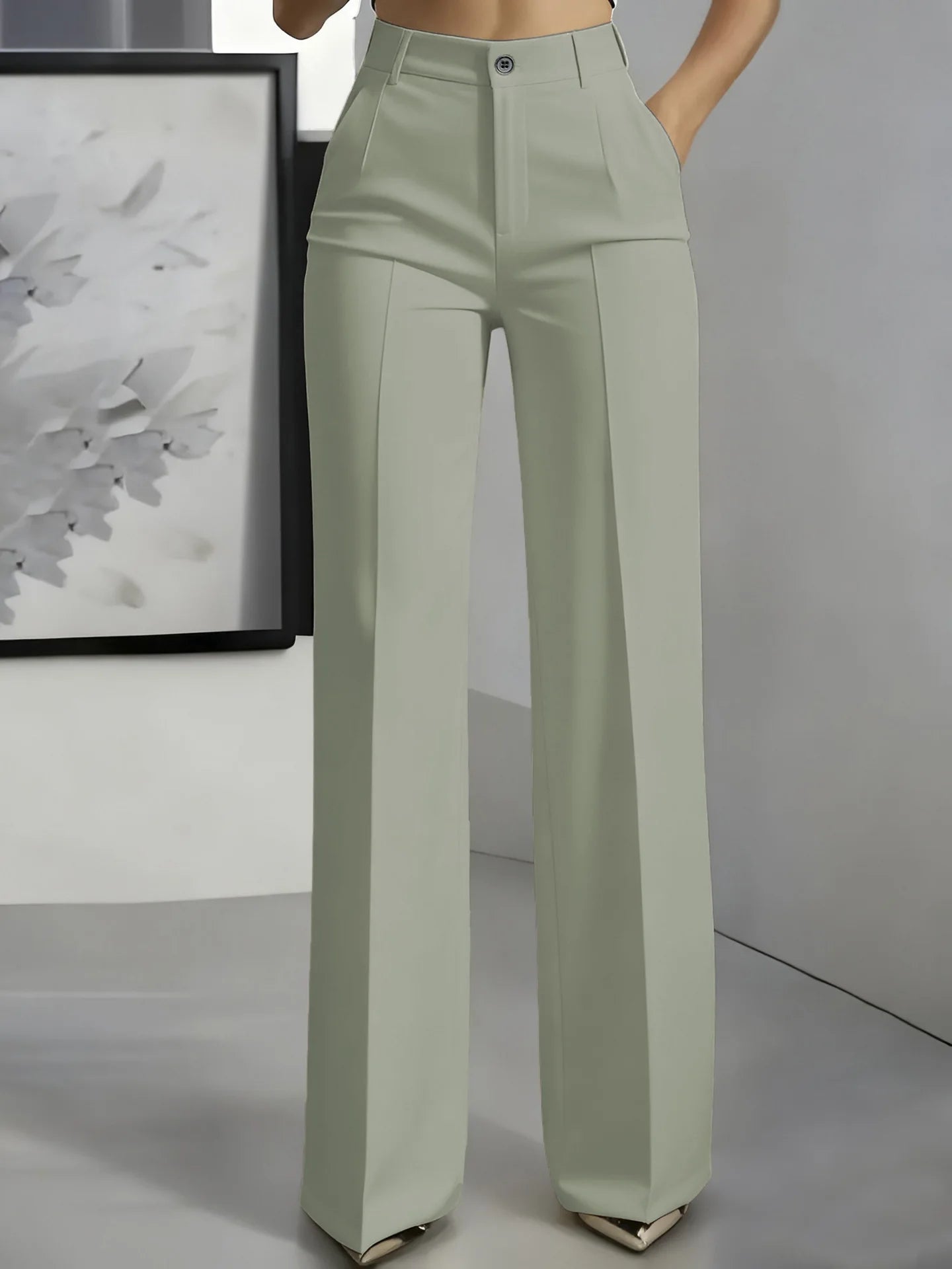 Women's high-waisted straight-leg trousers in light beige, formal office wear, slim-fit cut, solid color, made of smooth fabric.