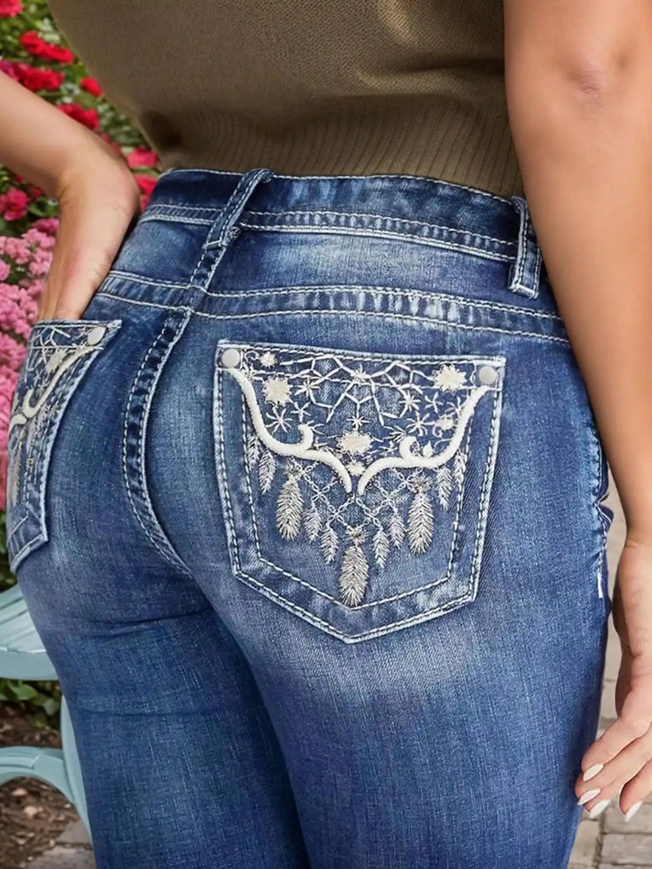 Women's Embroidered Wash Denim Jeans showing back pocket with white embroidery and heavy-duty stitching for style and