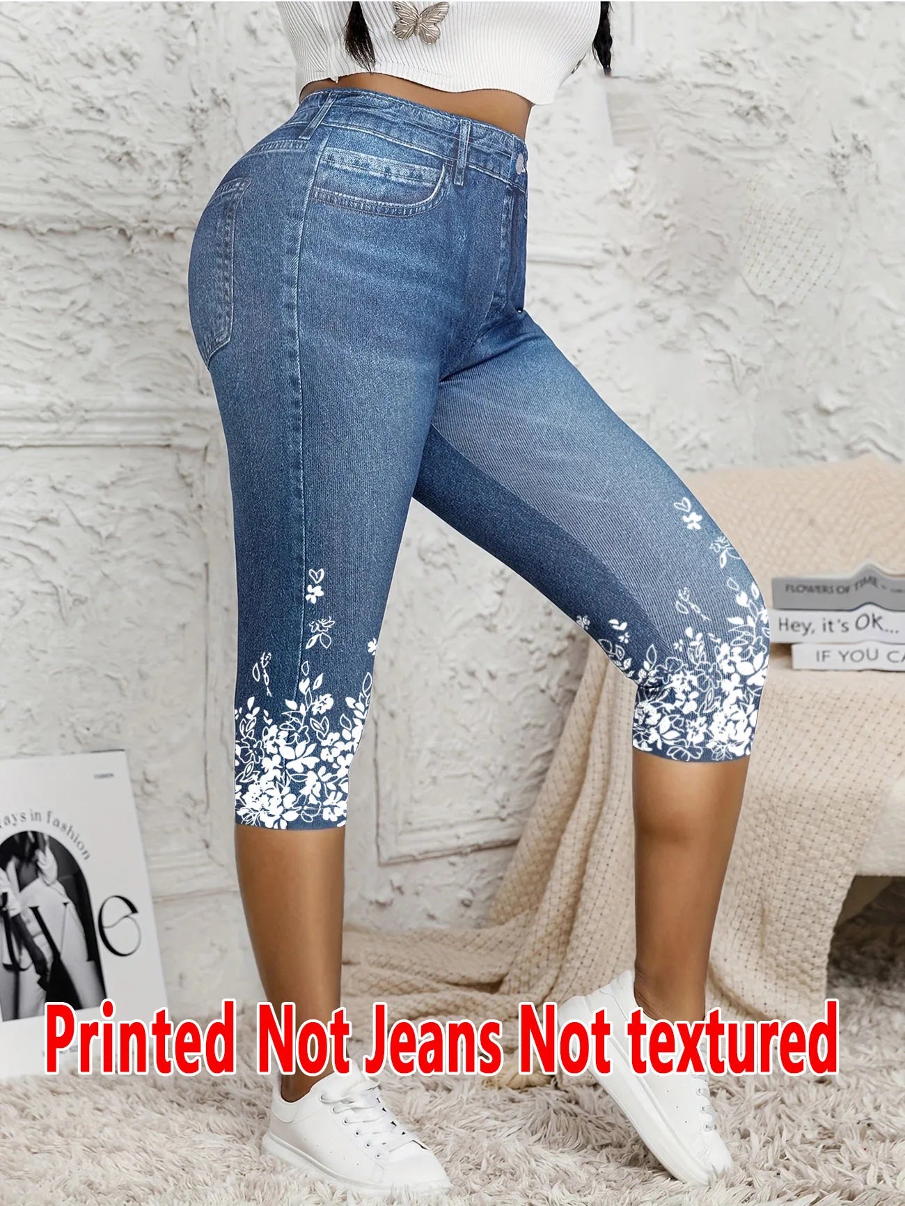 Ladies' seven-point printed leggings with faux denim print, white floral design at the hem, paired with white sneakers.