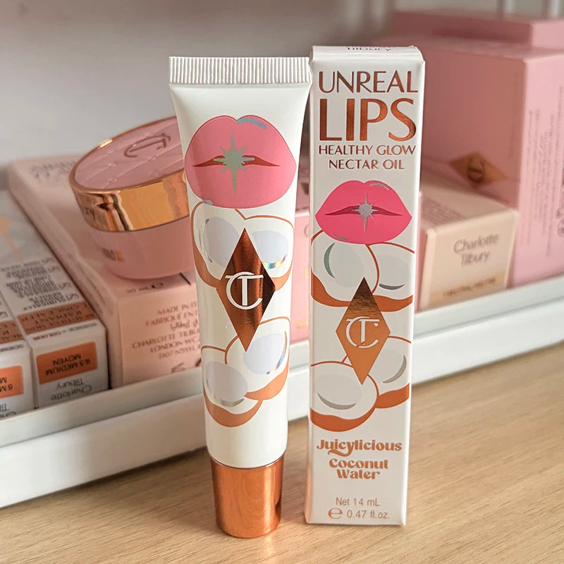 Charlotte Tilbury Walk of No Shame Graceful Pink lipstick and Unreal Lips Nectar Oil in Juicylicious Coconut Water flavor.