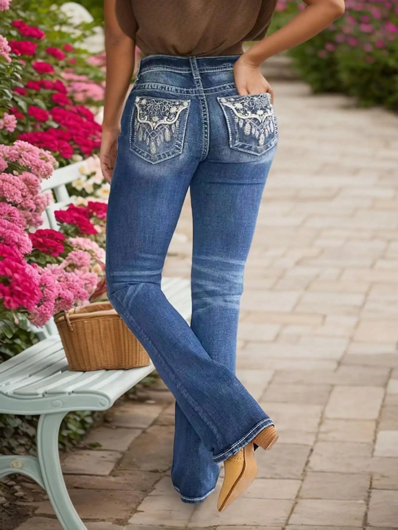 Women's Embroidered Wash Denim Jeans with heavy-duty stitching, styled for durability and fashion, shown on a woman outdoors.