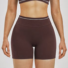 Women Running Sports Shorts Buttock Lift Gym Leggings Women Summer Shorts Cycling Slim Fit Workout Shorts High Waist Yoga Shorts in dark brown stretchy fabric.