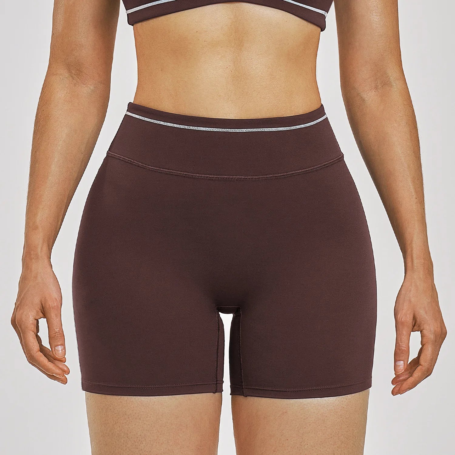Women Running Sports Shorts Buttock Lift Gym Leggings Women Summer Shorts Cycling Slim Fit Workout Shorts High Waist Yoga Shorts in dark brown stretchy fabric.