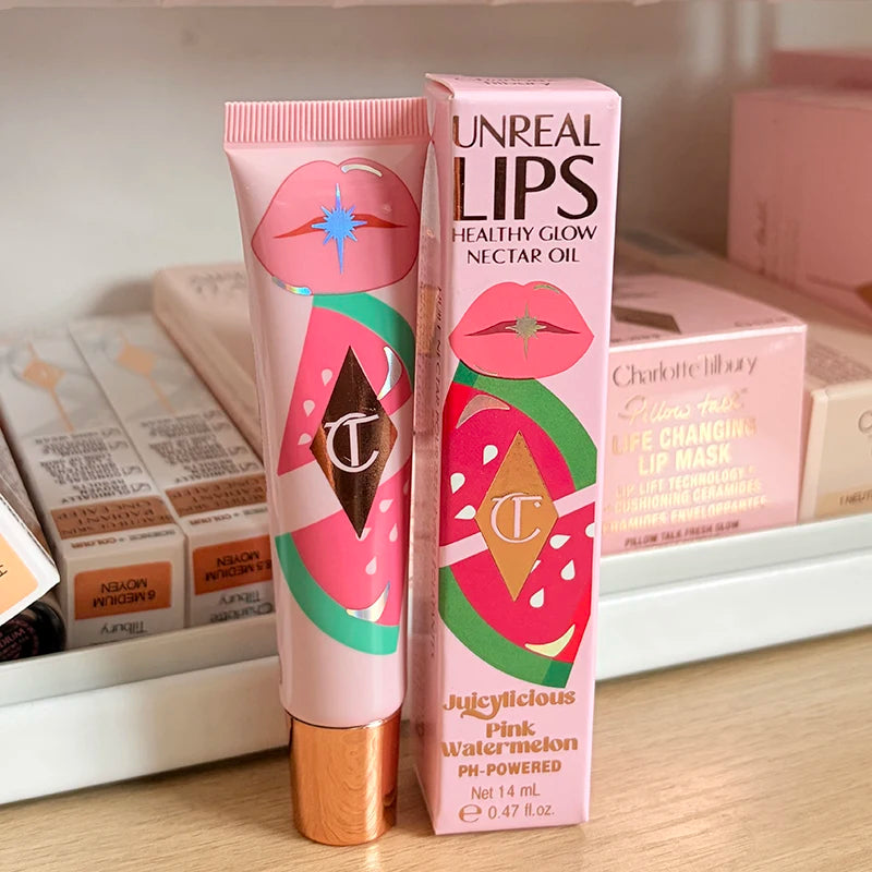 Charlotte Tilbury Juicylicious Pink Watermelon nourishing lip gloss with strawberry vanilla flavor, in a pink tube with