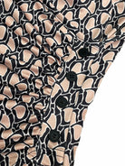 Women's floral print high waist sleeveless bodycon dress with ruffles, lightweight fabric, black buttons, suitable for summer vacations.
