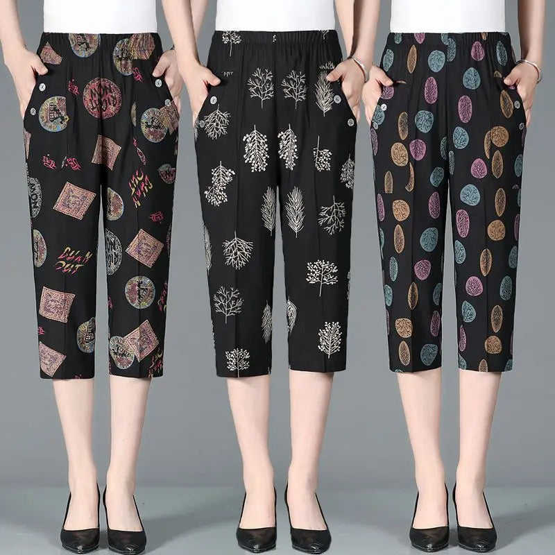 Summer New High Waist Capri Pants Elastic Casual Loose Straight Female Clothing with colorful patchwork, vintage printed patterns, and pockets.