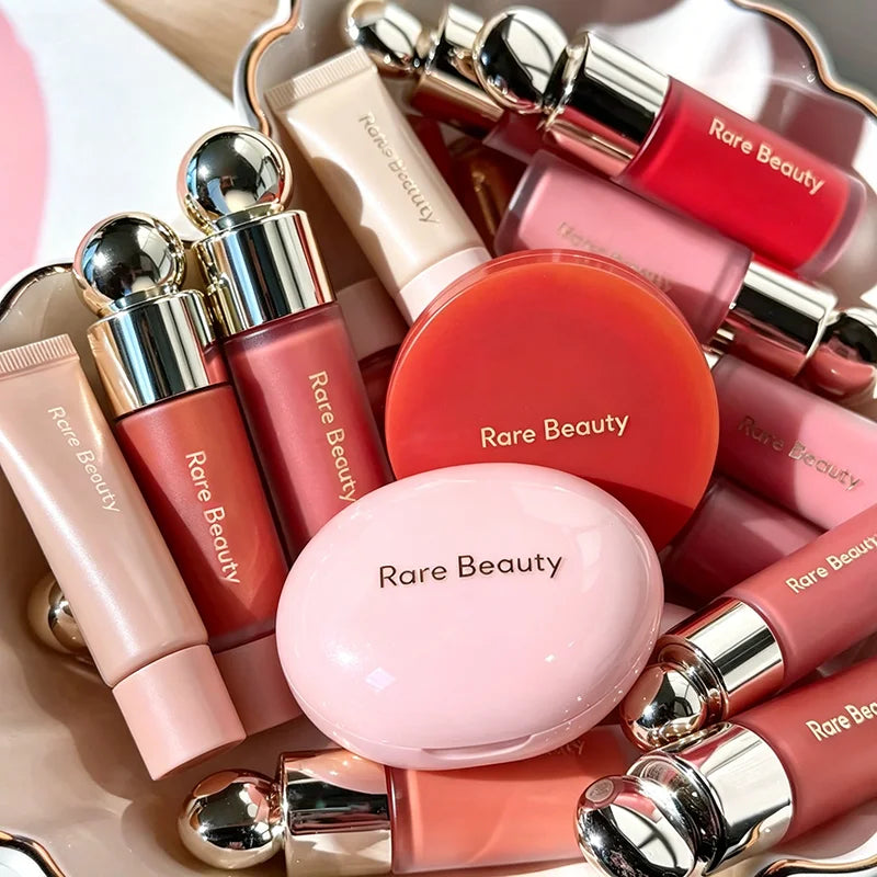 Rare Beauty Fashion long-lasting waterproof highlighter and contour face products in pink, peach, and red with glossy and