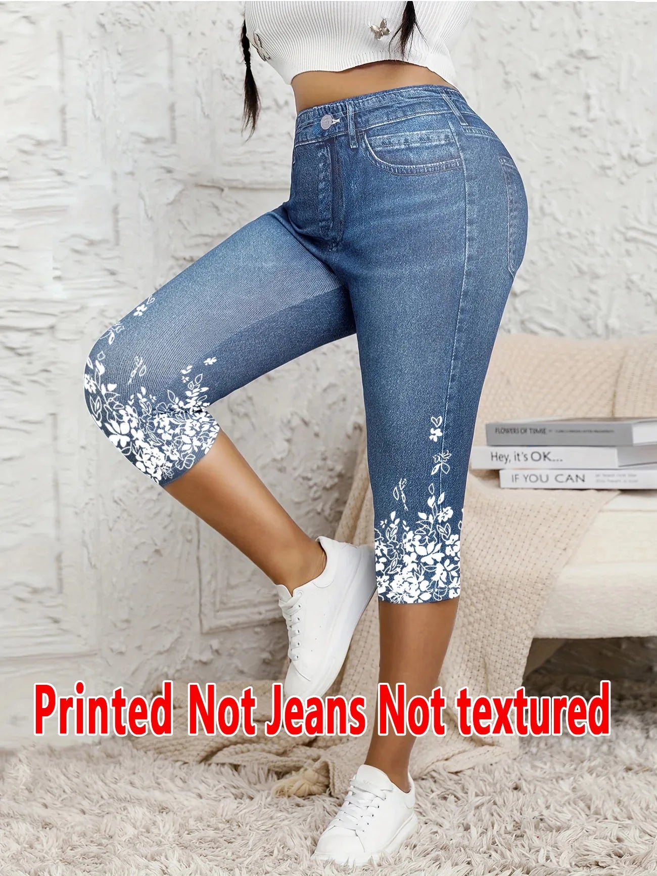 Printed Ladies' Seven-Point Leggings with faux denim print and white floral design at the hem, form-fitting and stretchable.