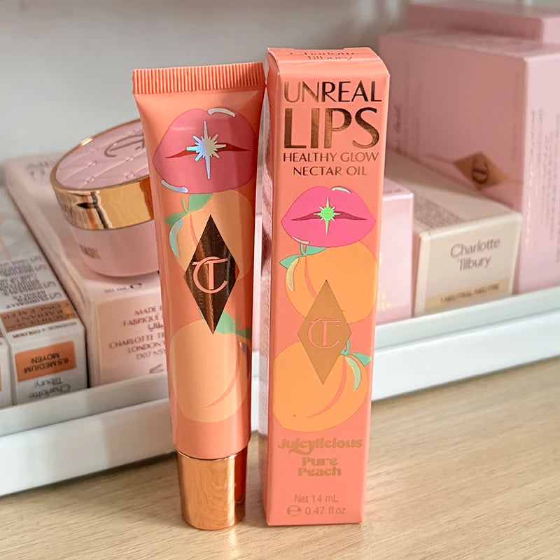 Charlotte Tilbury UnReal Lips Healthy Glow Nectar Oil in Juggling Pure Peach, peach-colored tube with pink lips and gold