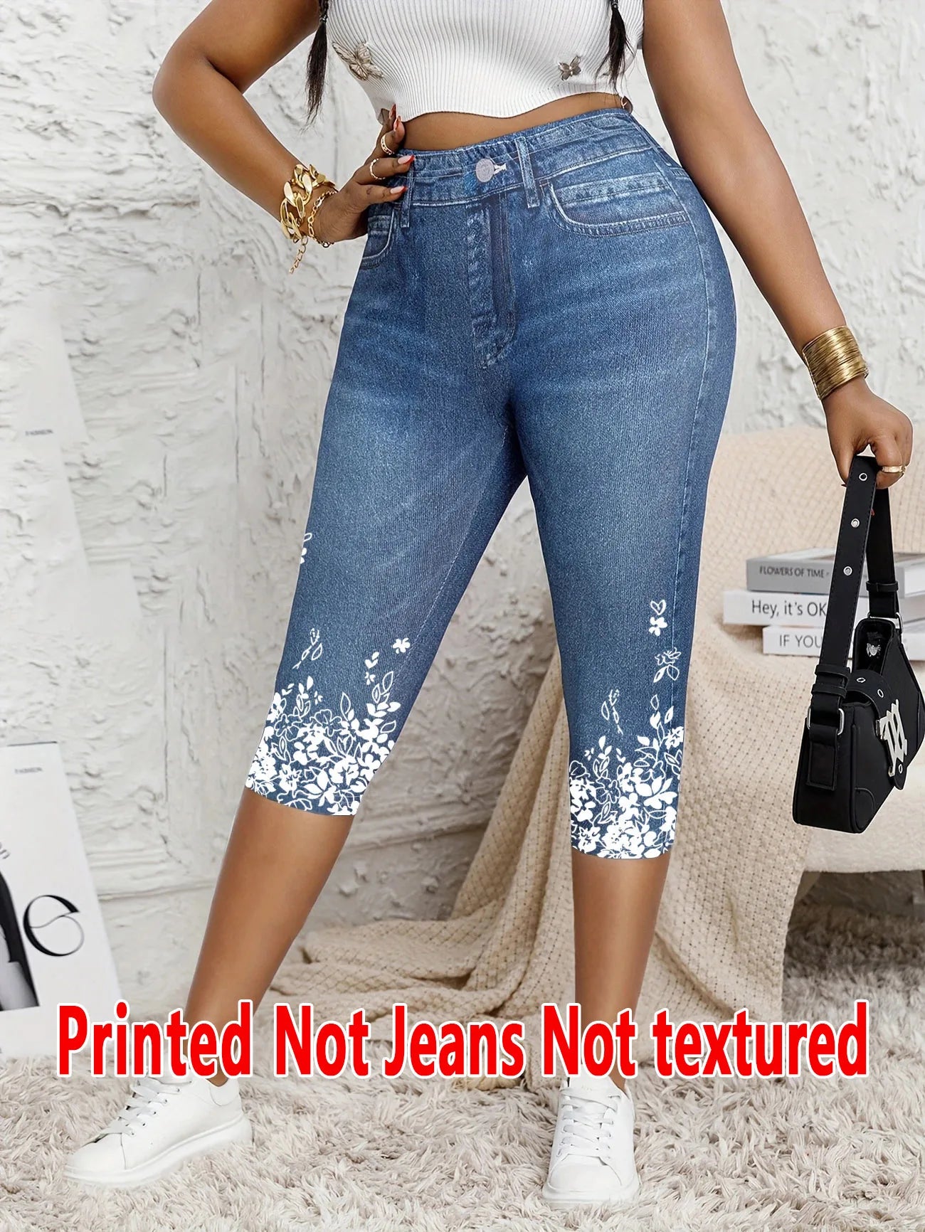 Printed Ladies' Seven-Point Leggings with faux denim print, white floral design at the hem, worn with white sneakers and gold accessories.