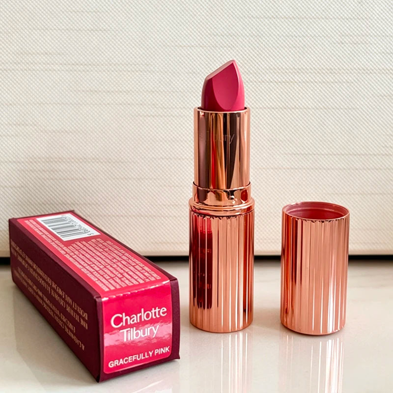 Charlotte Tilbury Walk of No Shame lipstick with pink shade in a rose gold tube, alongside Pillow Talk moisturizing plumping