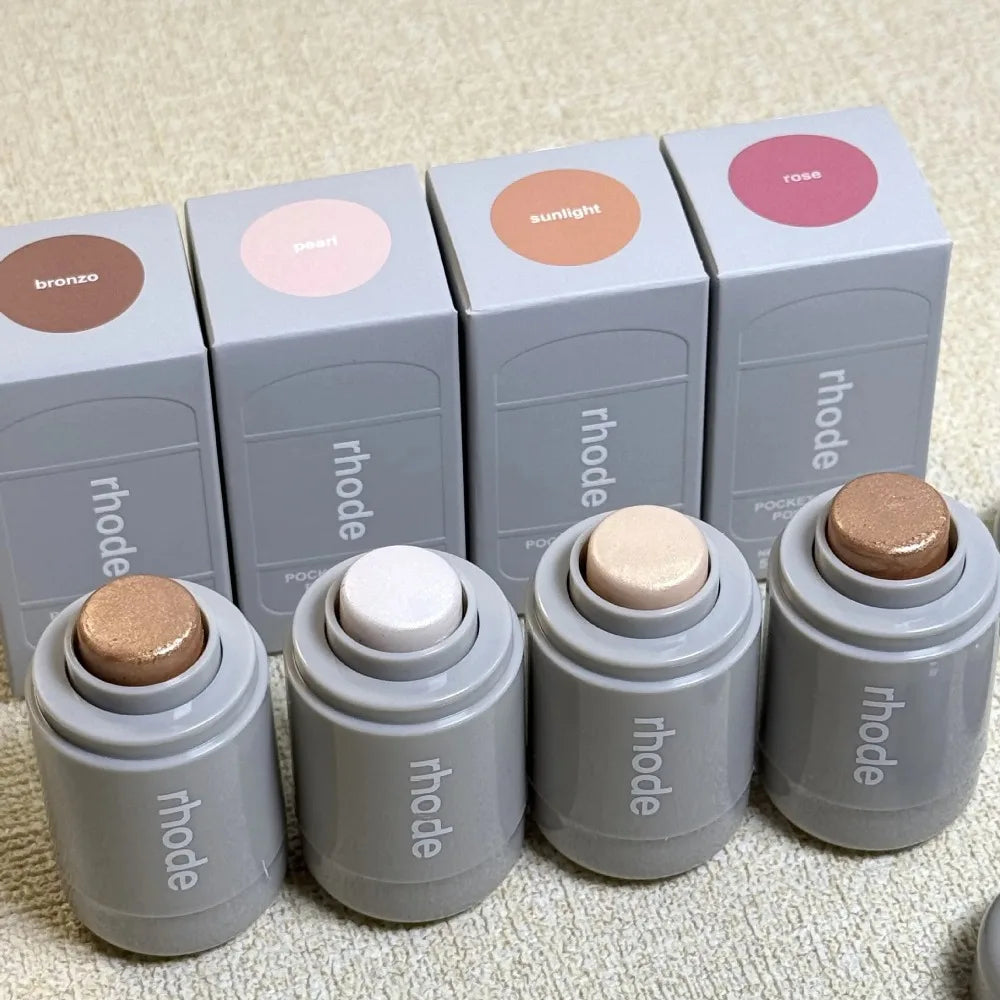 New Fine Glossy Cheekbones and Cheeks Highlight Stick set with four colors: bronze, pearl, sunlight, and rose, for