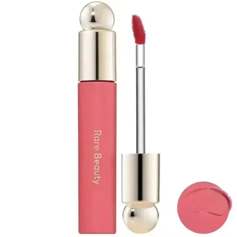 Rare Beauty 7-Colors Soft Pinch Tinted Lip Oil Stain Lip Gloss in pink with a silver and gold applicator and a matching pink