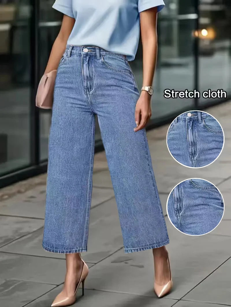 Women's High-Waisted Wide-Leg Capri Jeans in light blue denim with stretch cloth for a relaxed fit, shown with beige high