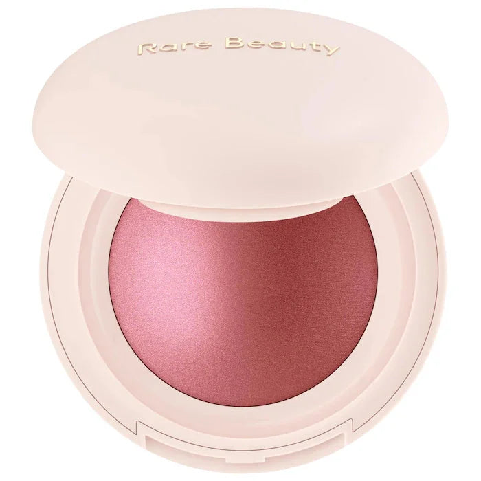 Rare Beauty Positive Light Powder Highlighter Blush with water-light shimmer in pink and mauve shades, waterproof and
