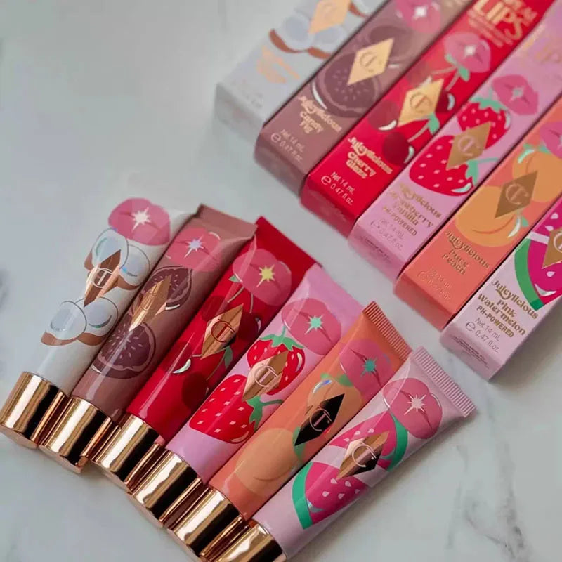 Charlotte Tilbury Walk of No Shame and Pillow Talk moisturizing plumping lip glosses in strawberry vanilla flavor, with