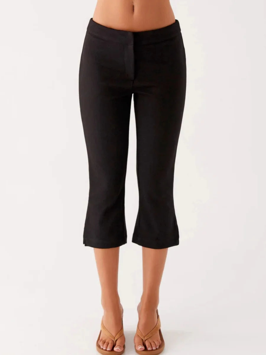 Women Summer Capri Pants Casual Low Waist Solid Color and Dot Print Slim Fit Cropped Trousers in black, lightweight fabric.