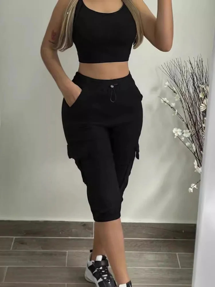 Summer Women's Slim-Fit Capri Trousers Solid Color Casual Multiple Pocket Lace-Up High Waist Tight Leggings Capri Pants in black, with drawstring waist and cargo pockets.