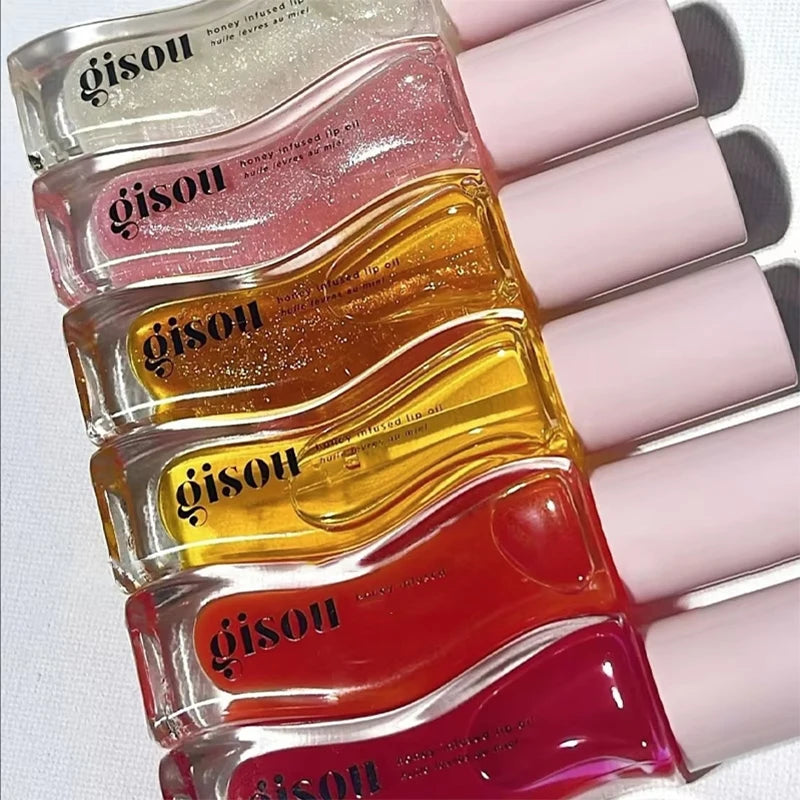 Gisou INS Popular Moisturizing Lip Balm set with cherry gloss, pink, yellow, and red lip oils in clear tubes with pink caps.