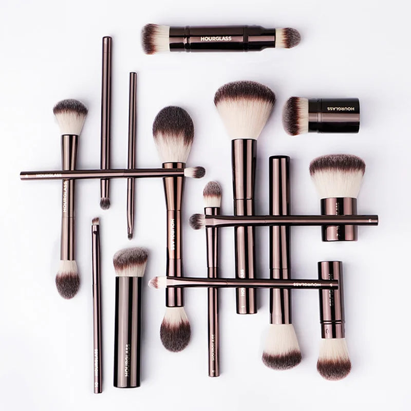 Hourglass Makeup Brushes set with rose gold handles and soft synthetic bristles, including powder, foundation, concealer, blush, bronzer, eye shadow, eyebrow, and eyeliner brushes.