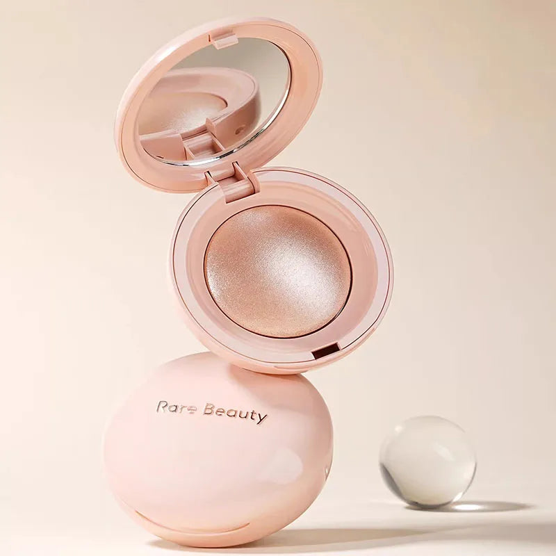 Rare Beauty Positive Light Powder Highlighter Blush Water Light Shimmer Waterproof Long Last Face Illuminator in a pink