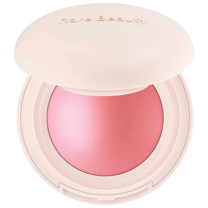 Rare Beauty Positive Light Powder Highlighter Blush in soft pink with shimmering, waterproof, long-lasting water light face