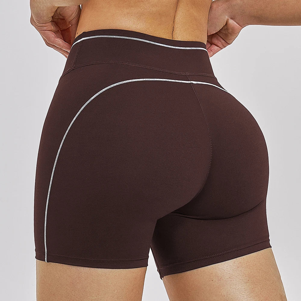 Women Running Sports Shorts Buttock Lift Gym Leggings Women Summer Shorts Cycling Slim Fit Workout Shorts High Waist Yoga Shorts in dark brown with white seam accents, designed for fitness activities.