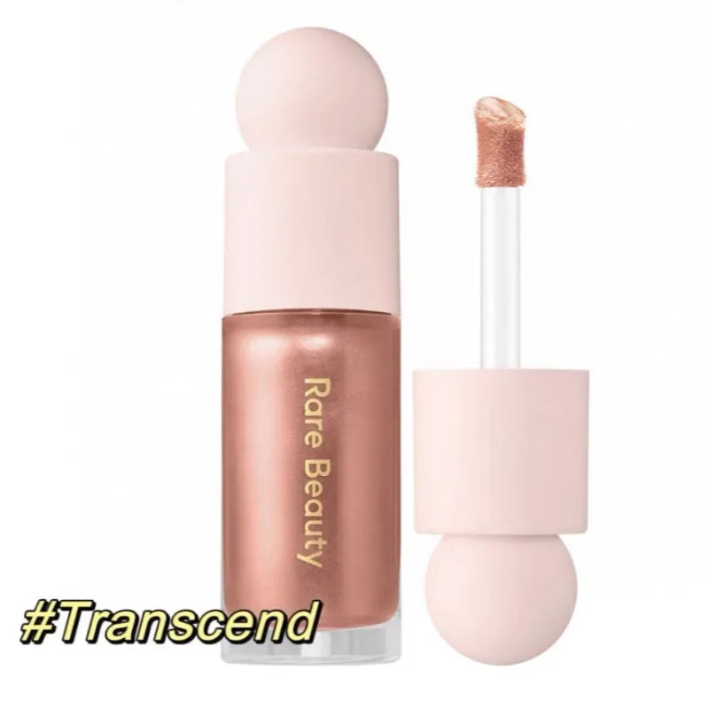 Rare Beauty Soft Pinch Liquid Blush in a peachy-pink shade with a smooth applicator and pink cap, long-lasting and silky in texture.