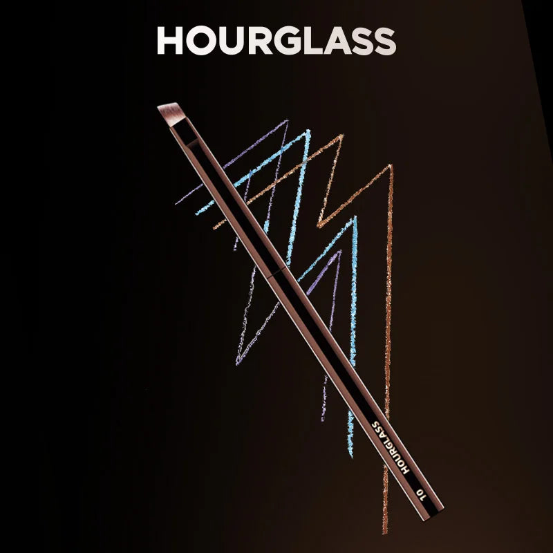 Hourglass Makeup Brushes Powder Foundation Concealer Blusher Bronzer Eye Shadow Eyebrow Eyeliner Sculpting Brush on black background with colorful chalk lines.