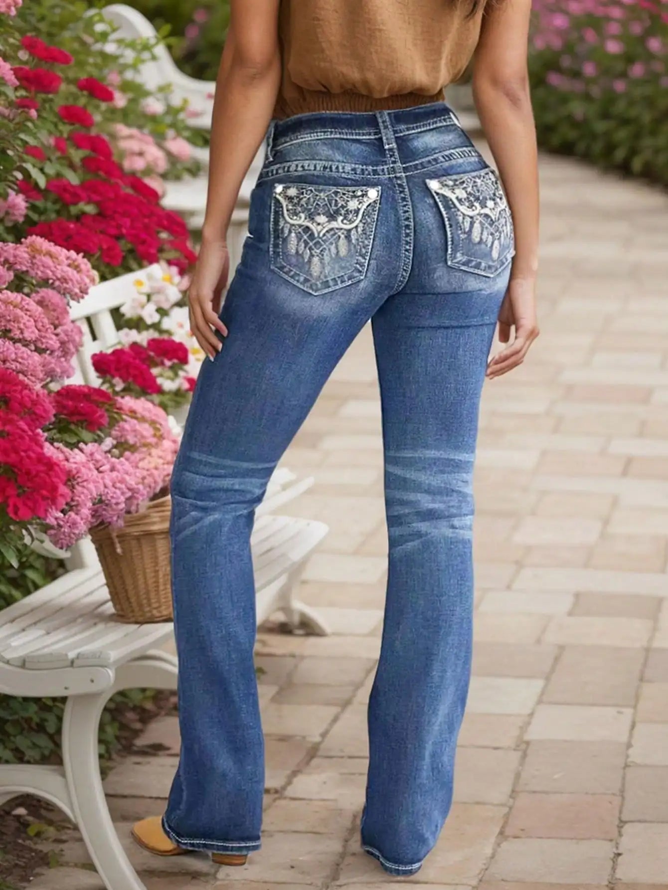 Women's Embroidered Wash Denim Jeans with heavy-duty stitching and intricate embroidery on back pockets, in blue wash.