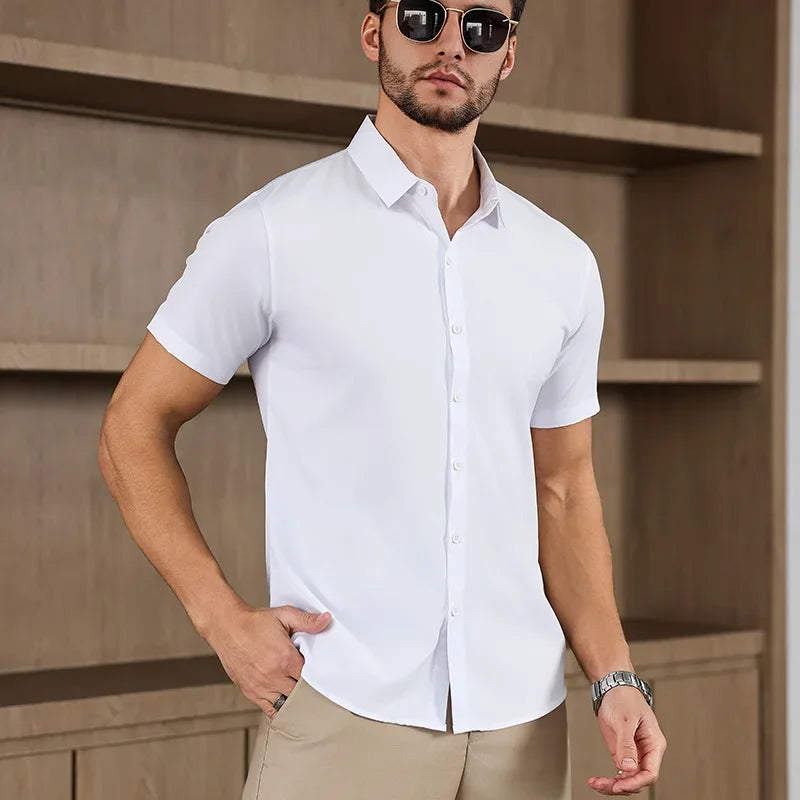 Men's business casual solid color short-sleeved shirt for summer, no ironing, comfortable, versatile top, white, worn by a male model.
