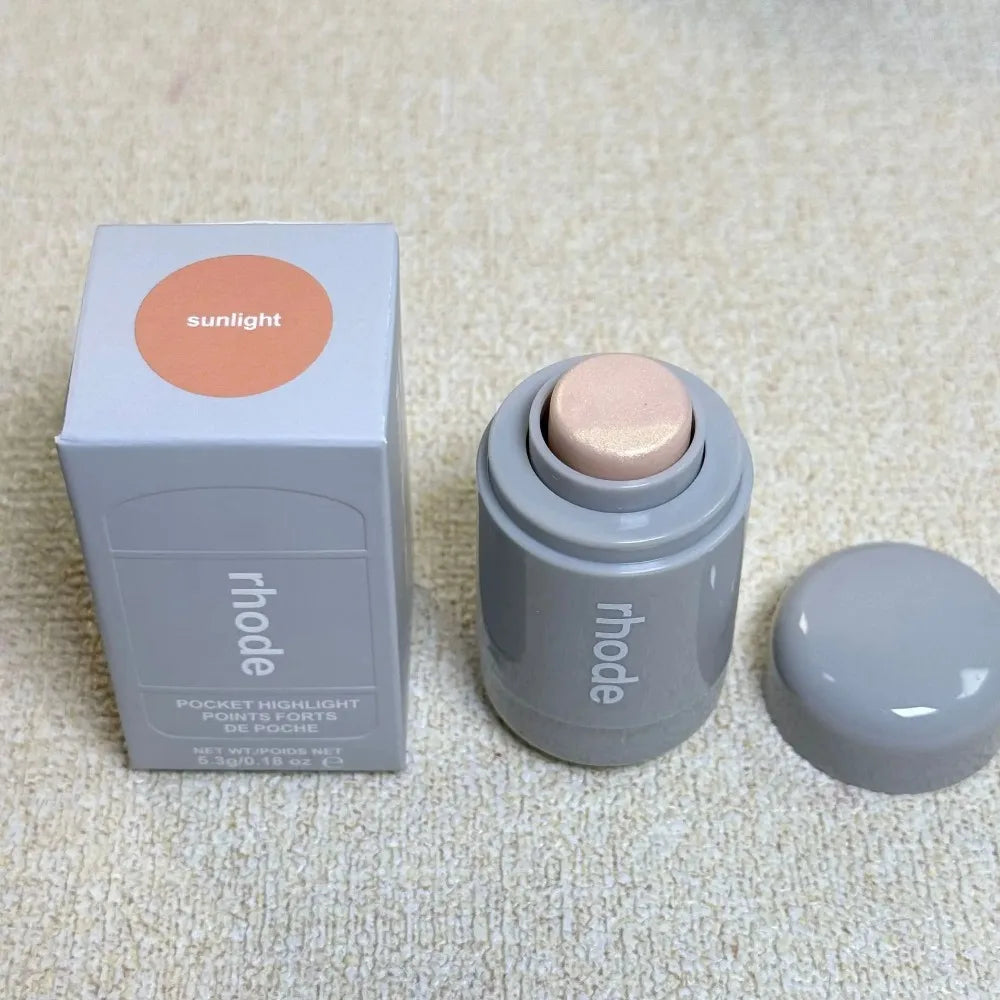 Rhode New Fine Glossy Cheekbones and Cheeks Brightening Bronzo Ssunlight Pearl Rose highlight stick in a light pink shade